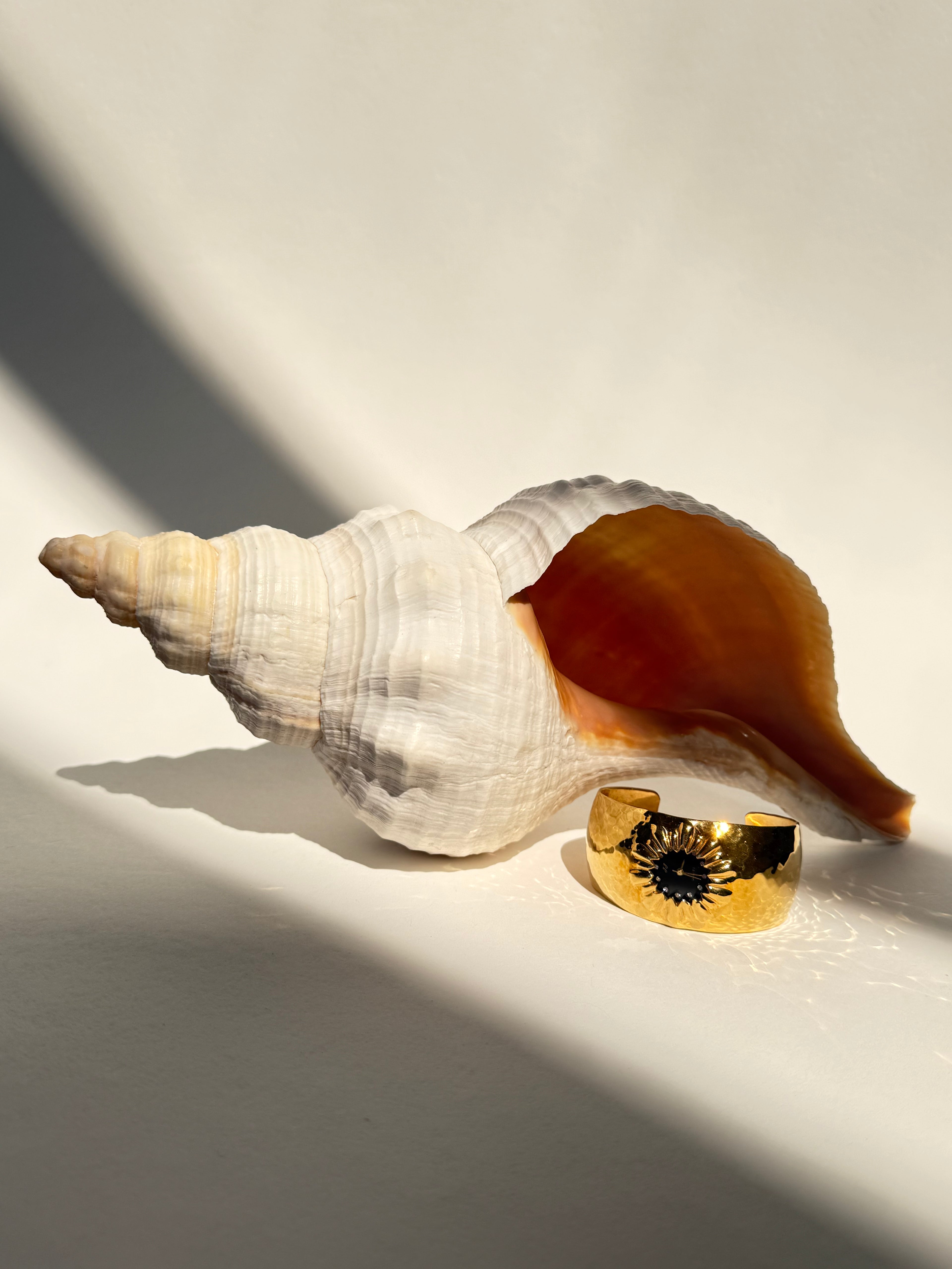 GOLD STARBURST CUFF WATCH