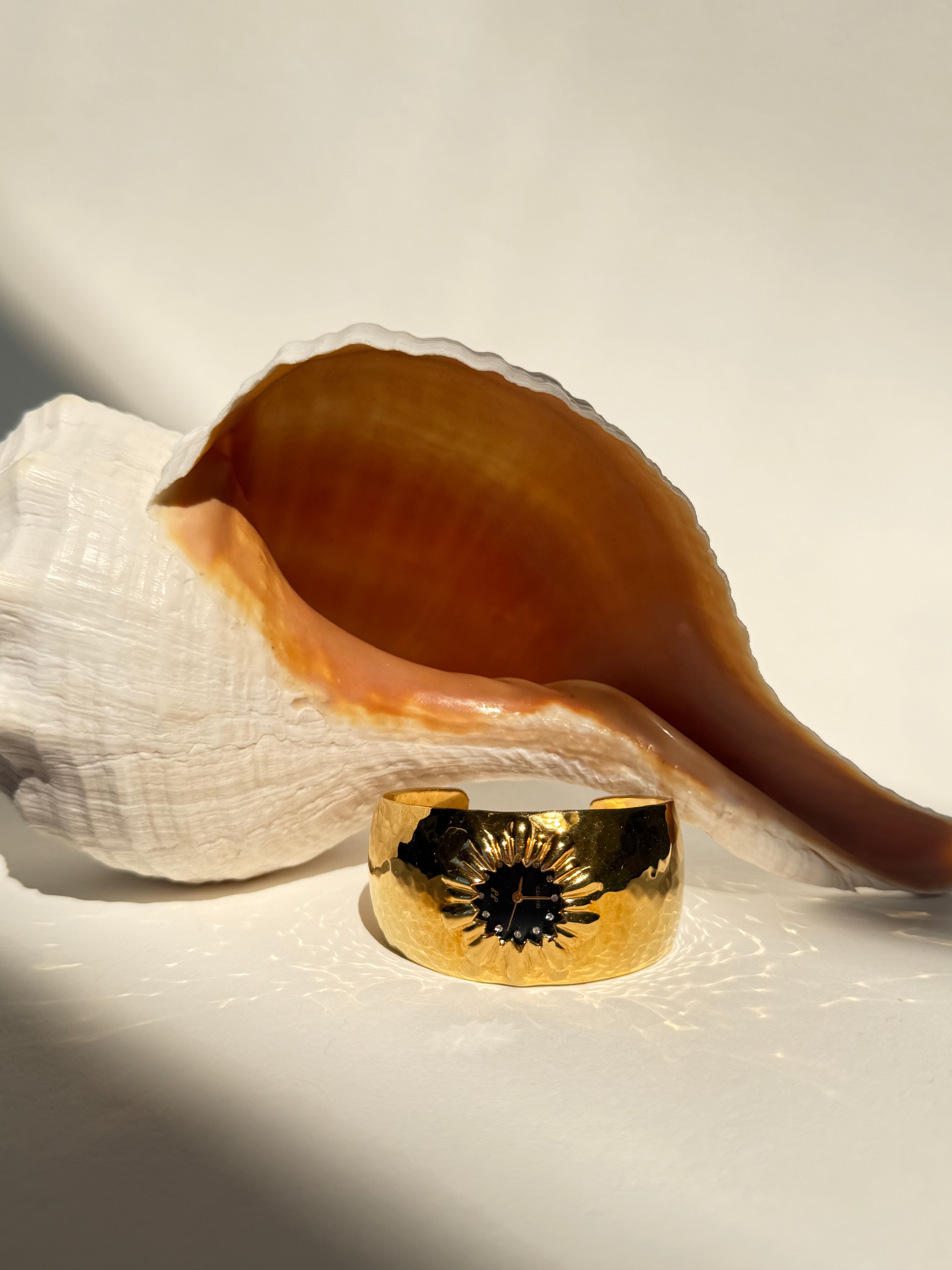 GOLD STARBURST CUFF WATCH