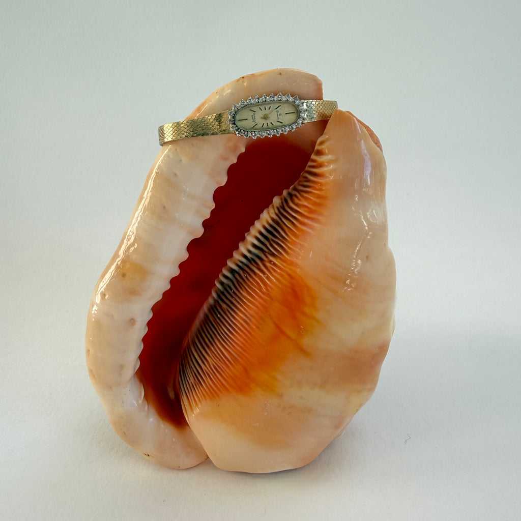 GOLD AND SWAROVSKI CRYSTAL WRIST WATCH